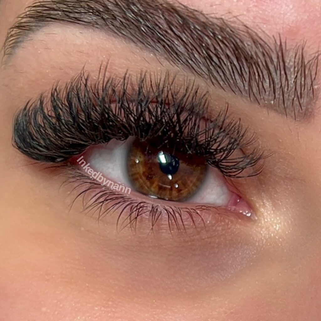 A photo of a woman's eye up close, showing off her new Y-lash extensions.