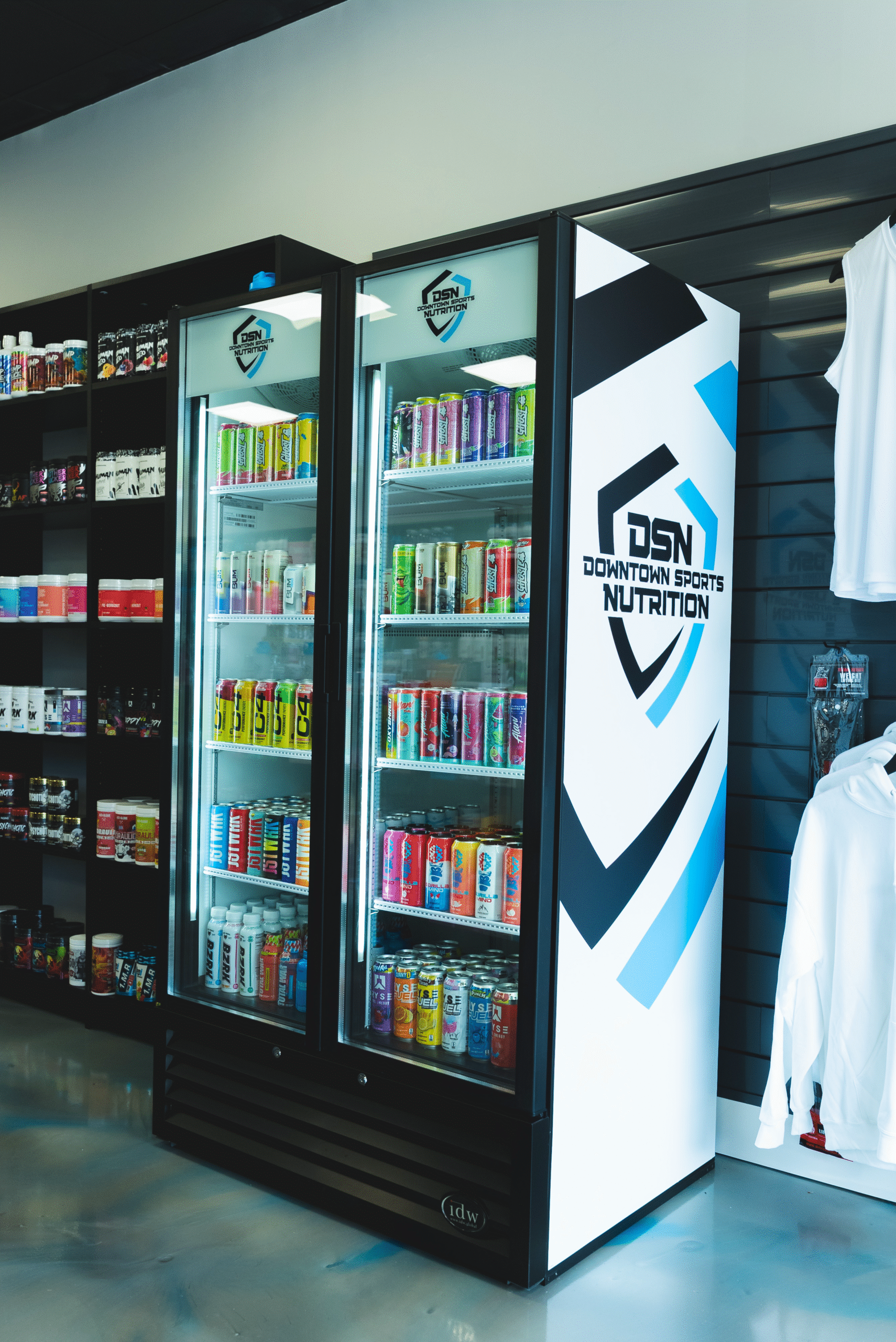 A photo of a cold drinks fridge, inside the DSN nutrition store.