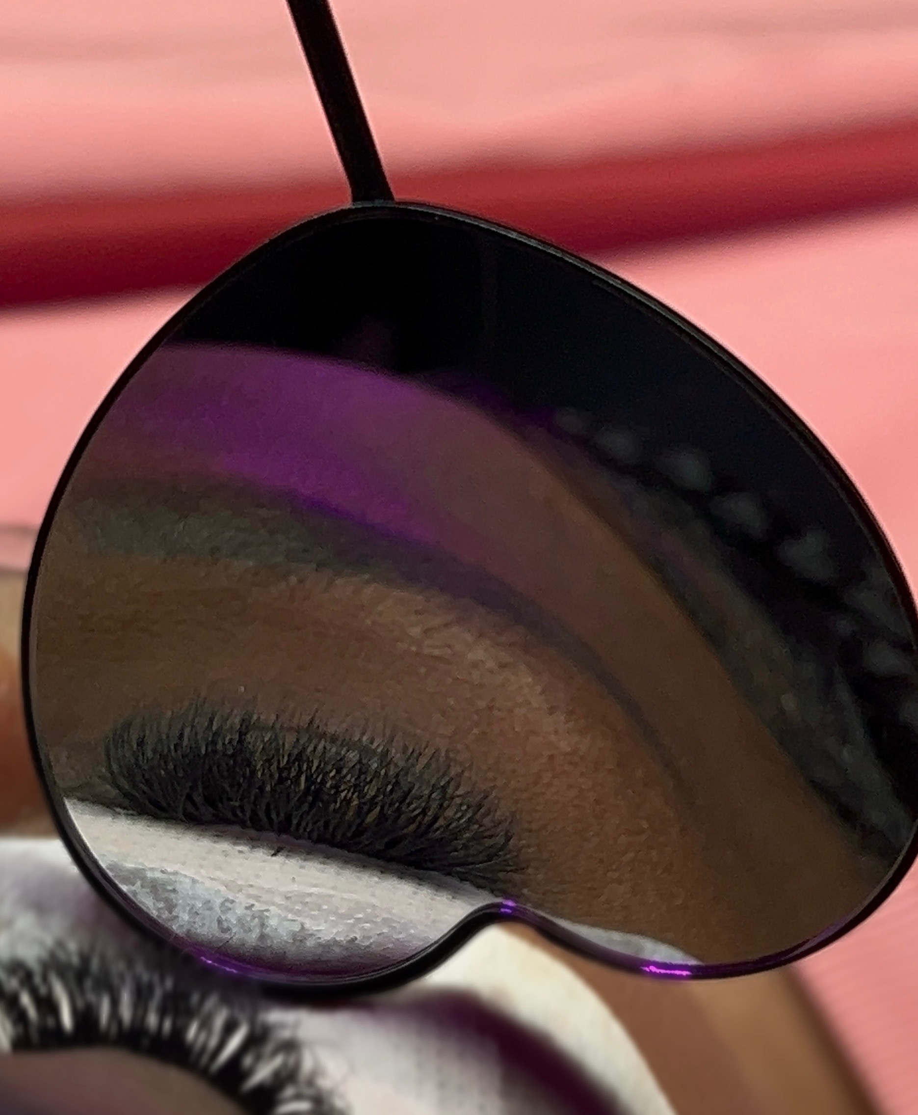 A close-up of a womans eye, showing off her new hybird lash extensions.