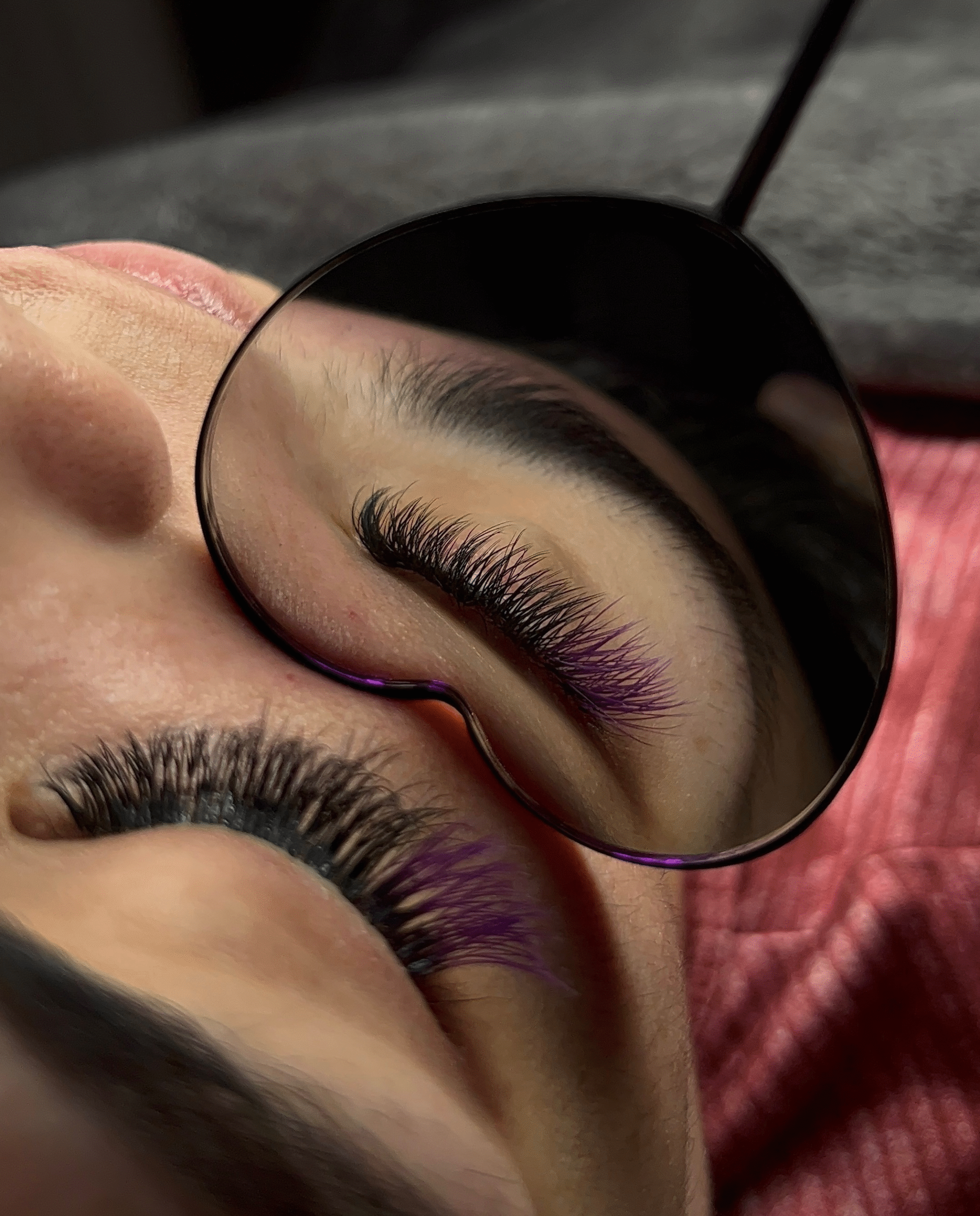 A close-up of a womans eye, showing off her new y-lash extensions.