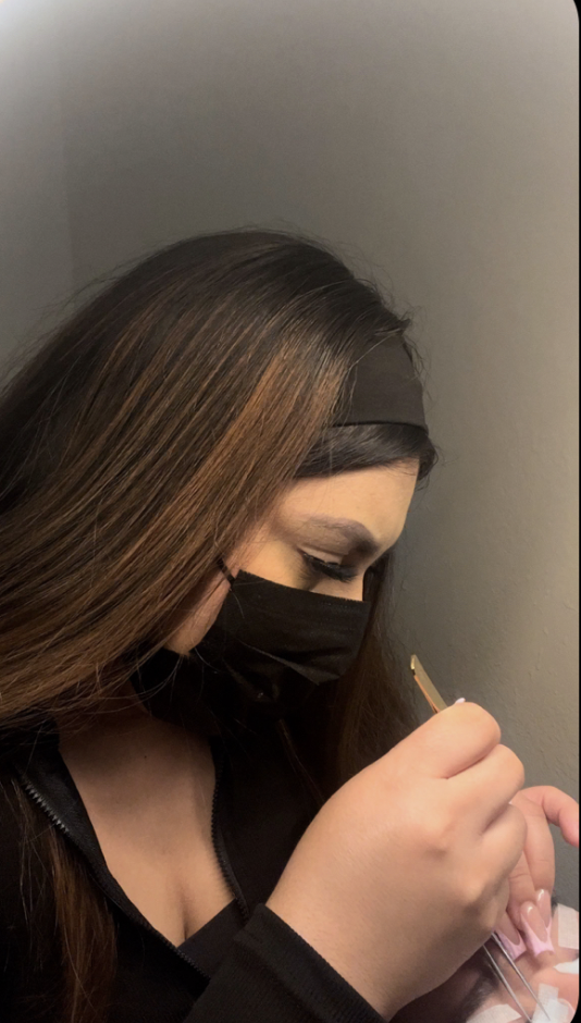 A graphic of a cartoon hot chili pepper wearing a sombrero, with a background of flames. The text shows Yonkue Kandys business' instagram (@yonkue_kandy) and their business name.