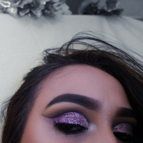 A woman eyes, showing off her newly done glam makeup.