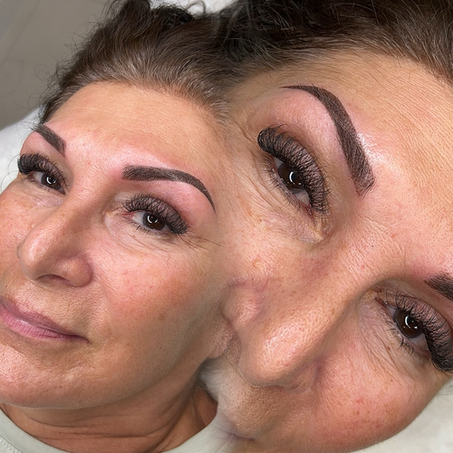 A woman laying down, showing off her newly done brow tattoo.